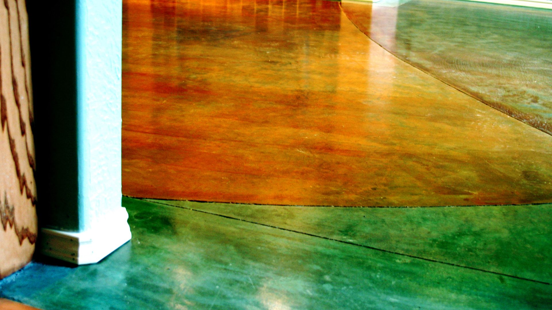 Polished concrete floor with orange and green gradient colors